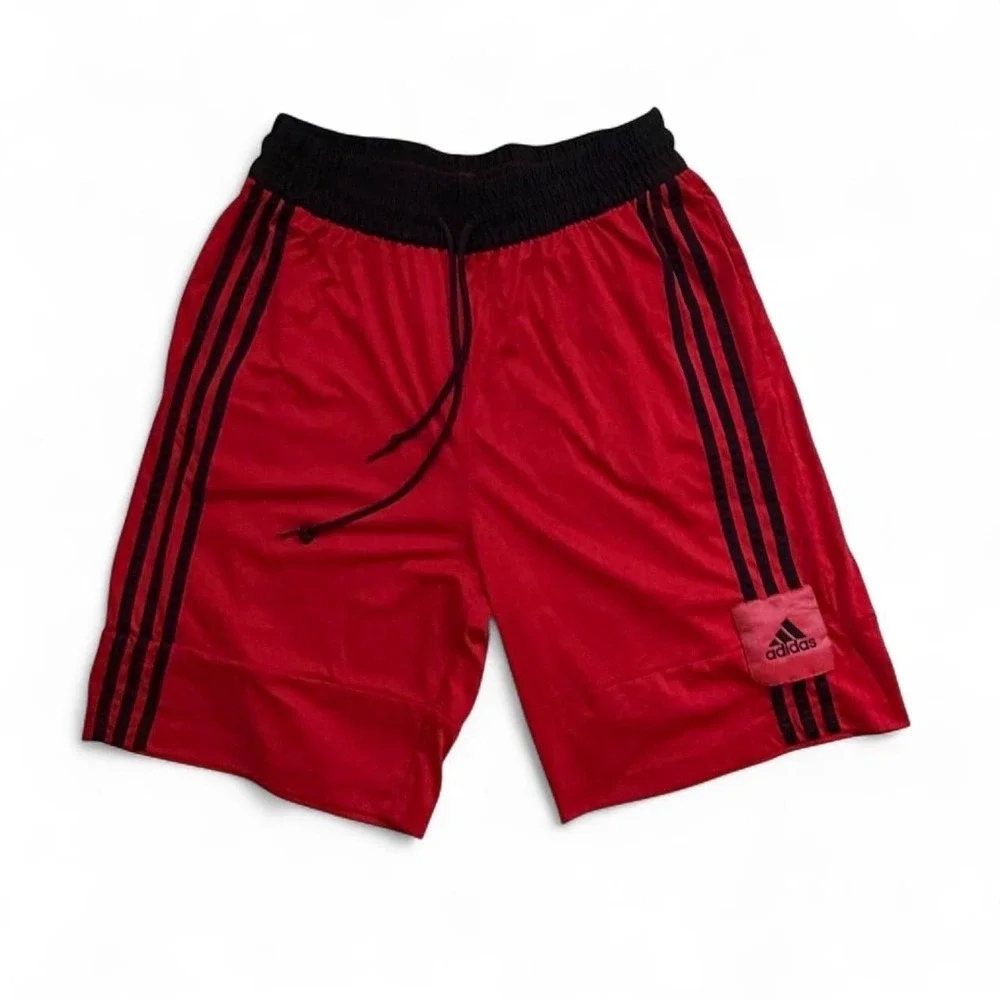Adidas red shorts with black stripes